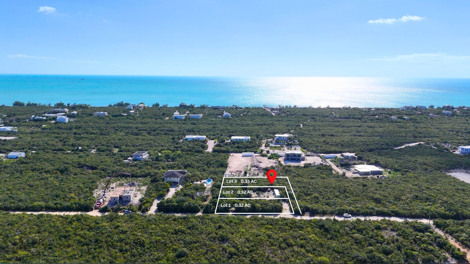 Lot 3 marked behind Lots 1 and 2 on Flame Tree Circle, with the ocean beyond