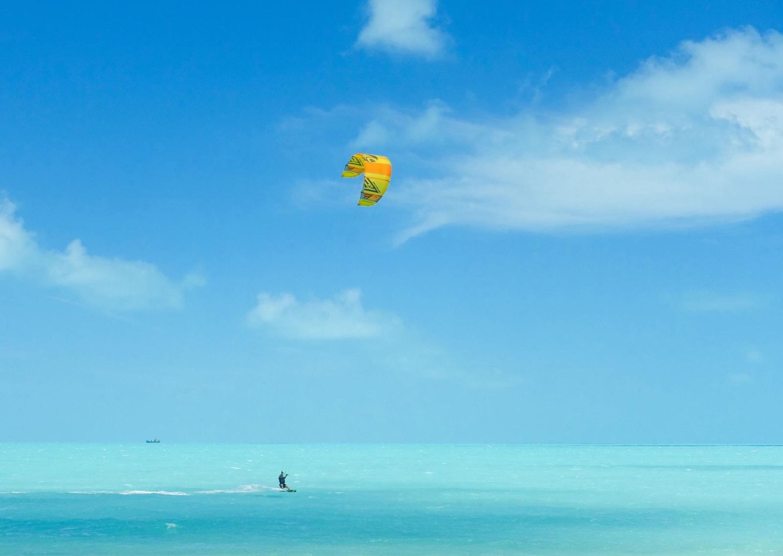 A kiteboarder on the shallows at Long Bay