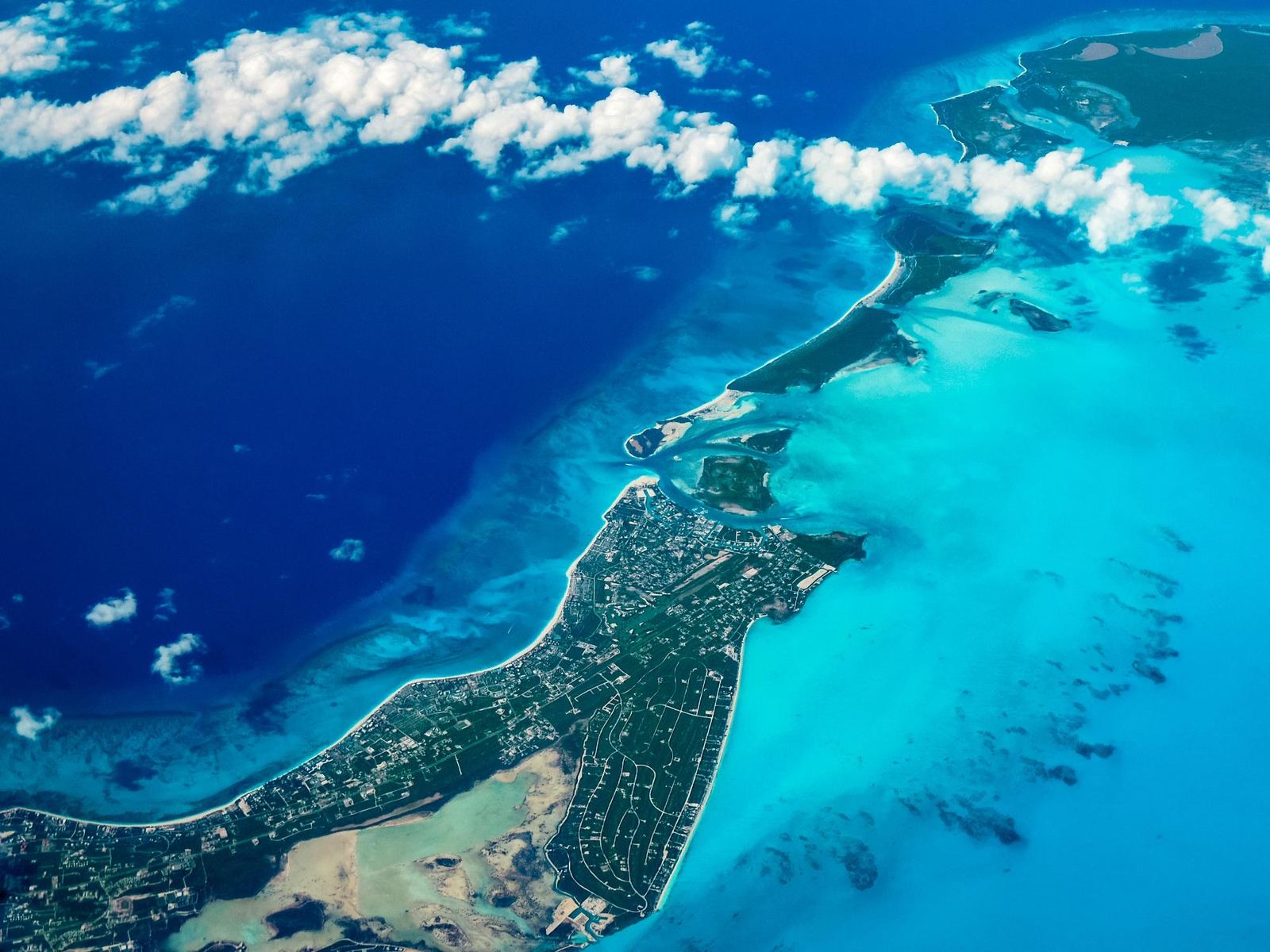 The east end of Providenciales from the air, with Grace Bay on one side and Long Bay on the other